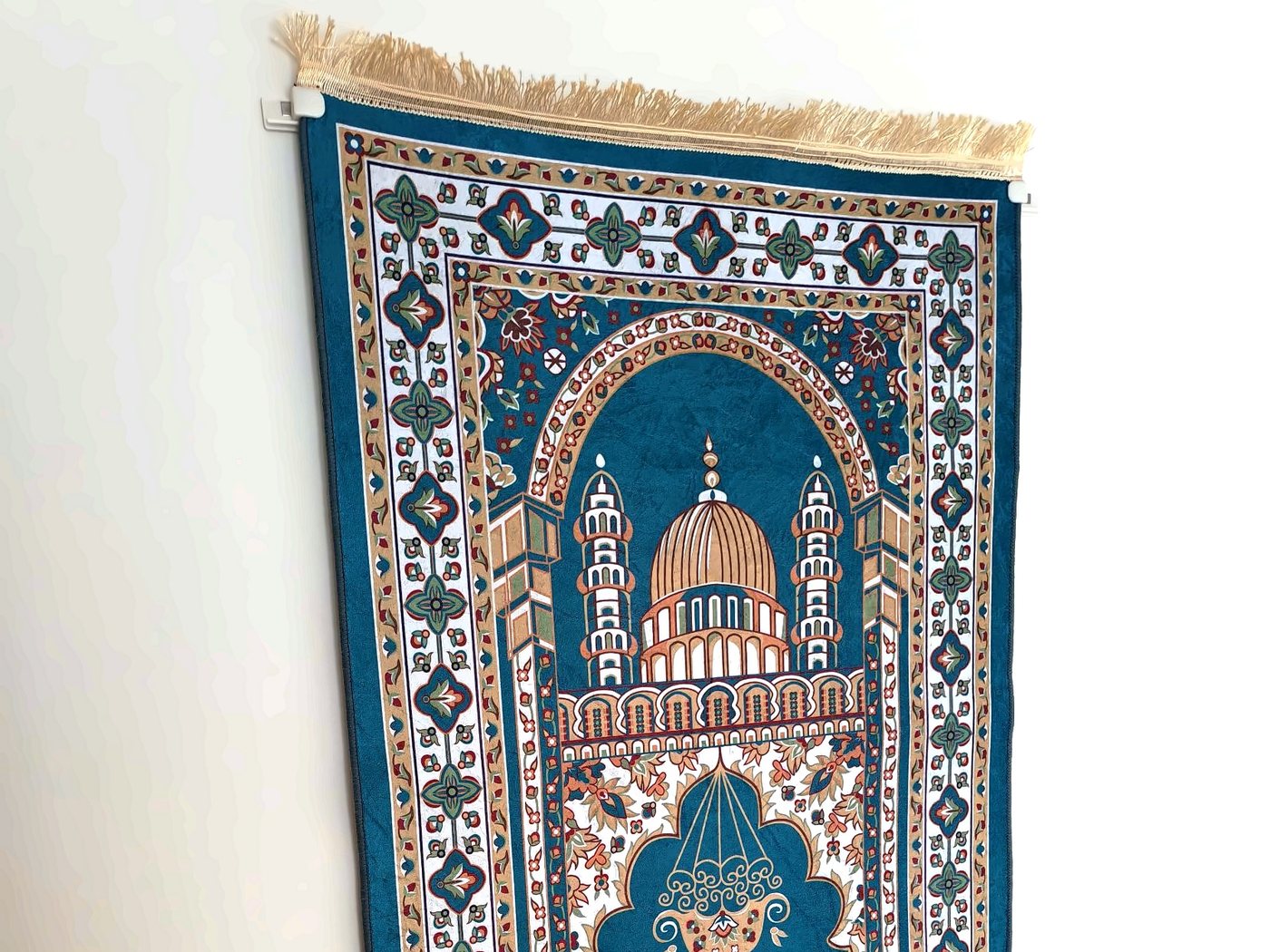 Photo of a prayer mat hanging flat on a wall, seen from the side